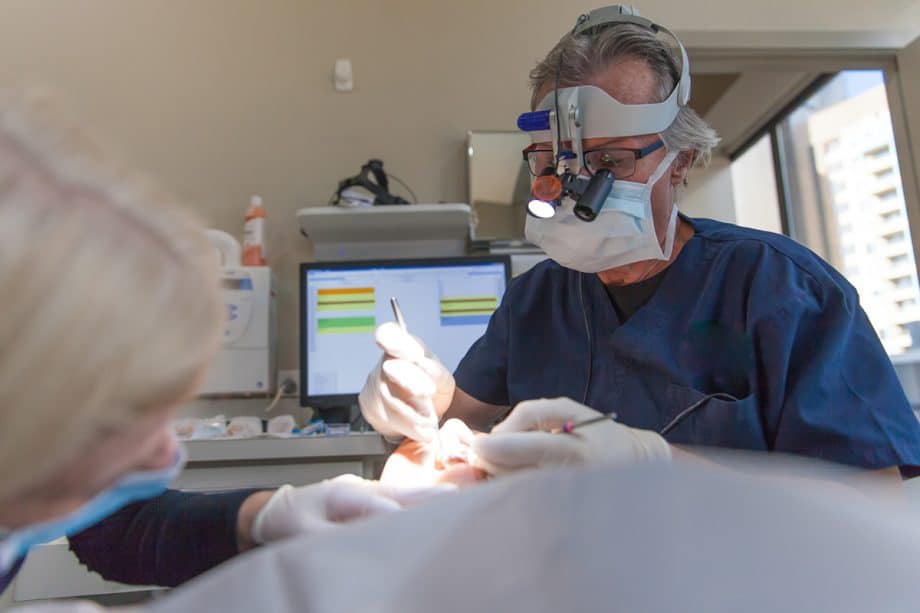 Dentist doing a tooth extraction