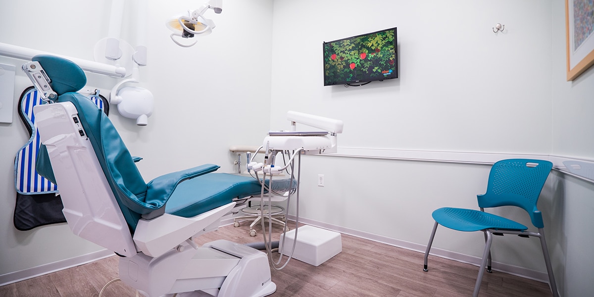dental examination room with blue chairs