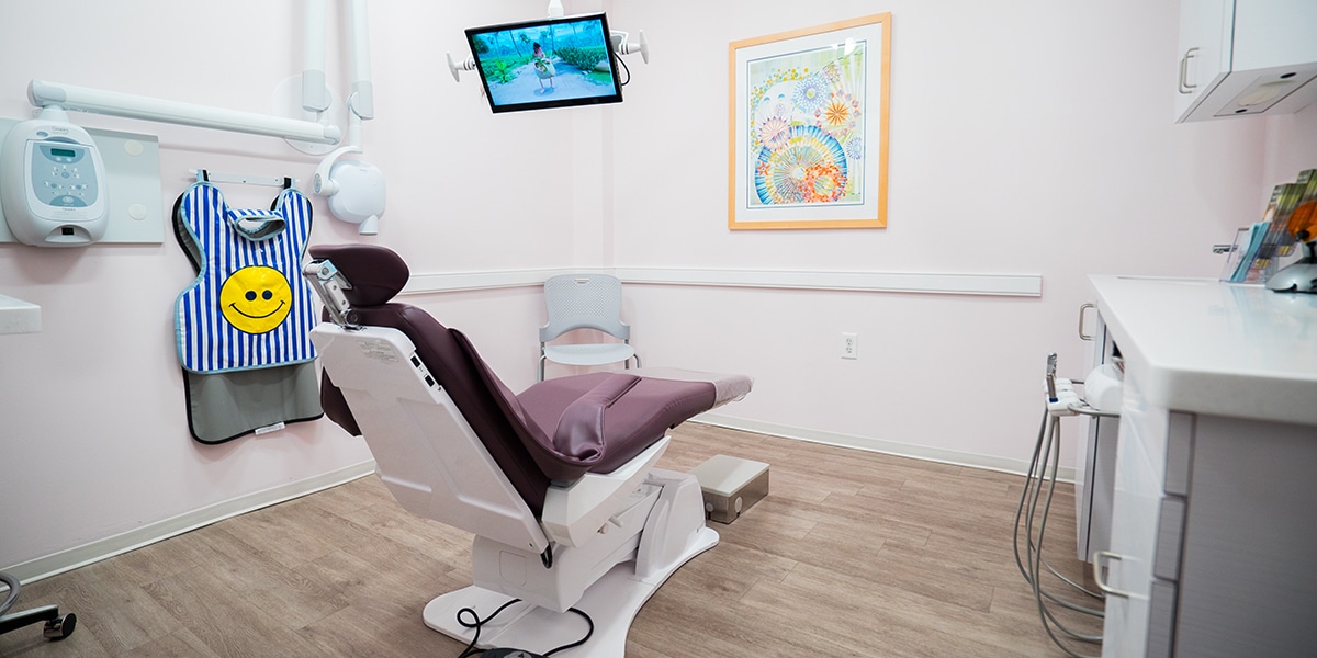 dental exam room with overhead TV