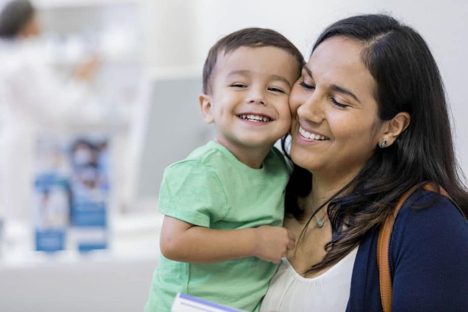 mom and toddler boy, smiling, cheek to cheek